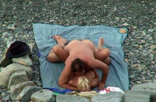 couple having sex on the beach